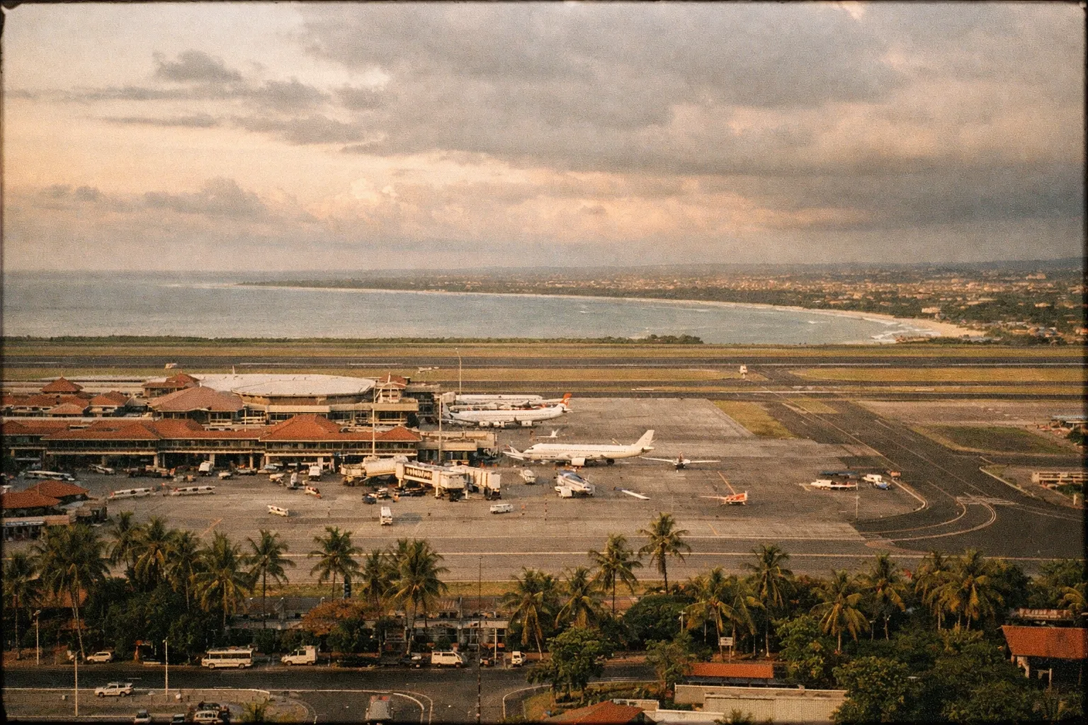Aerial view of Ngurah Rai International Airport near Denpasar, Bali, at golden hour.