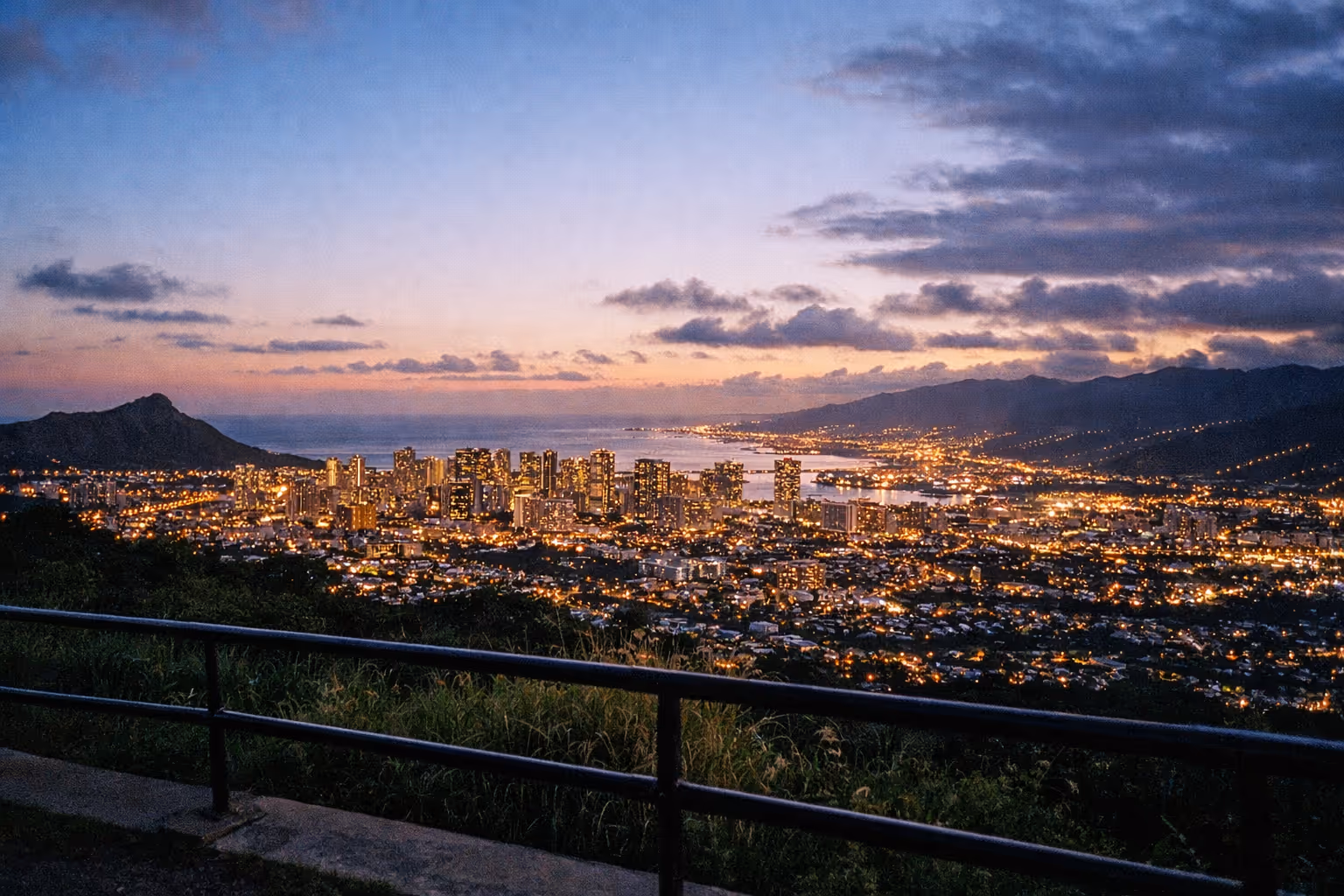Honolulu city skyline and Diamond Head seen at sunset from Tantalus Lookout.