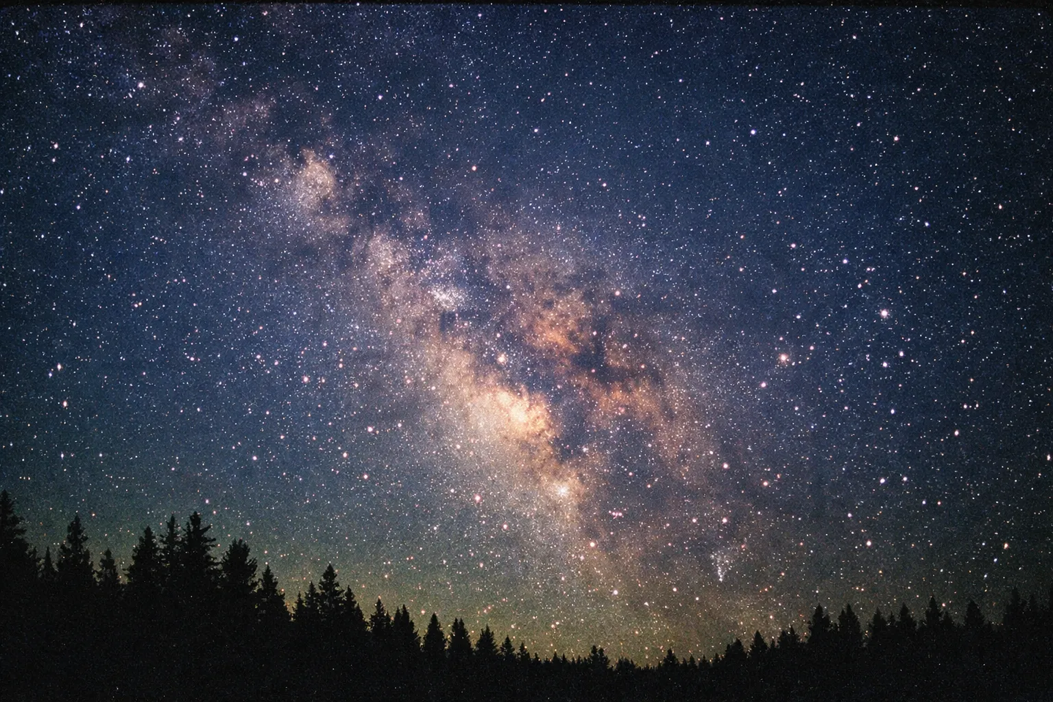 Milky Way over treeline at Cherry Springs, foreground dark forest silhouette