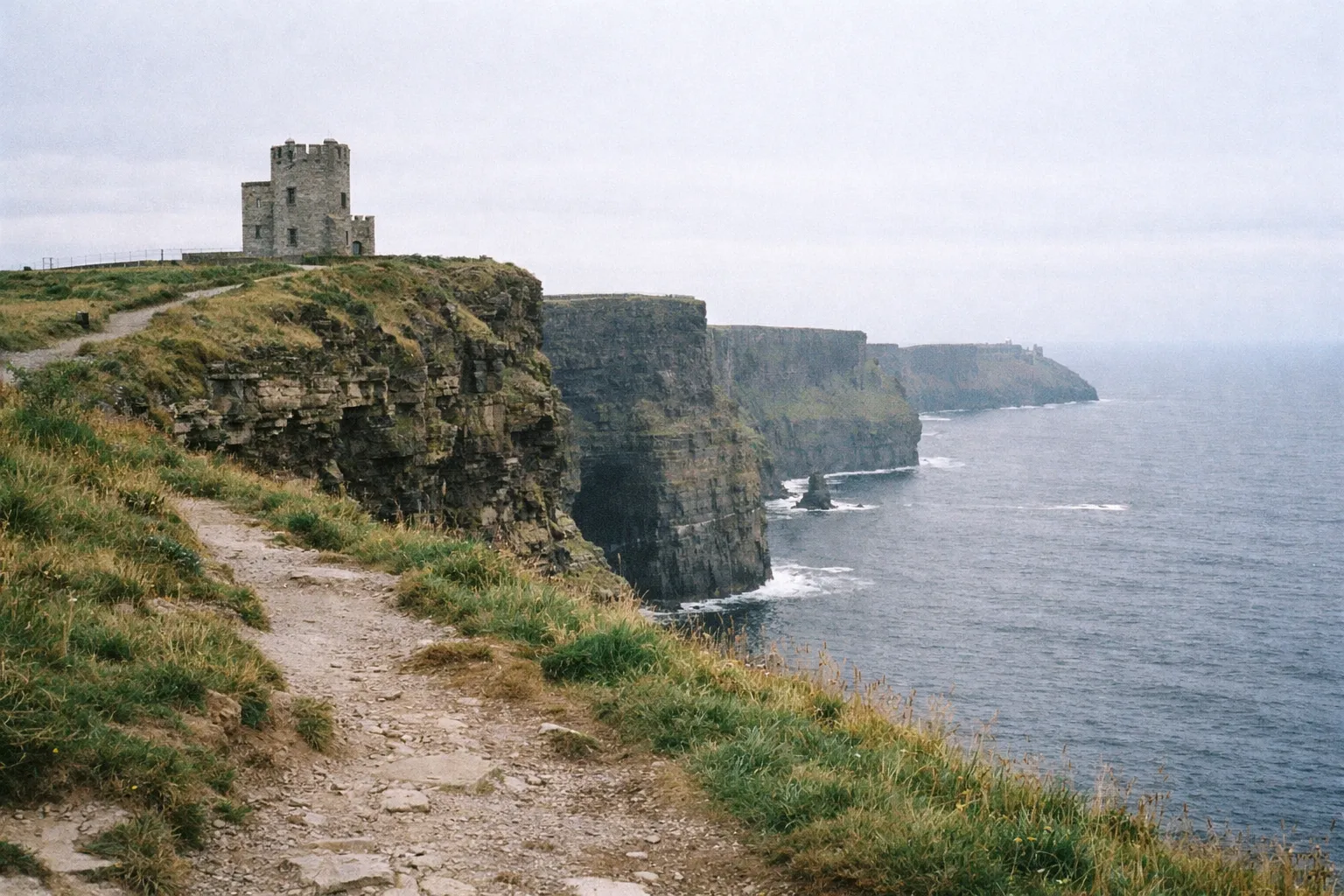 O'Brien's Tower stands on the edge of the Cliffs of Moher overlooking the Atlantic Ocean in Ireland.