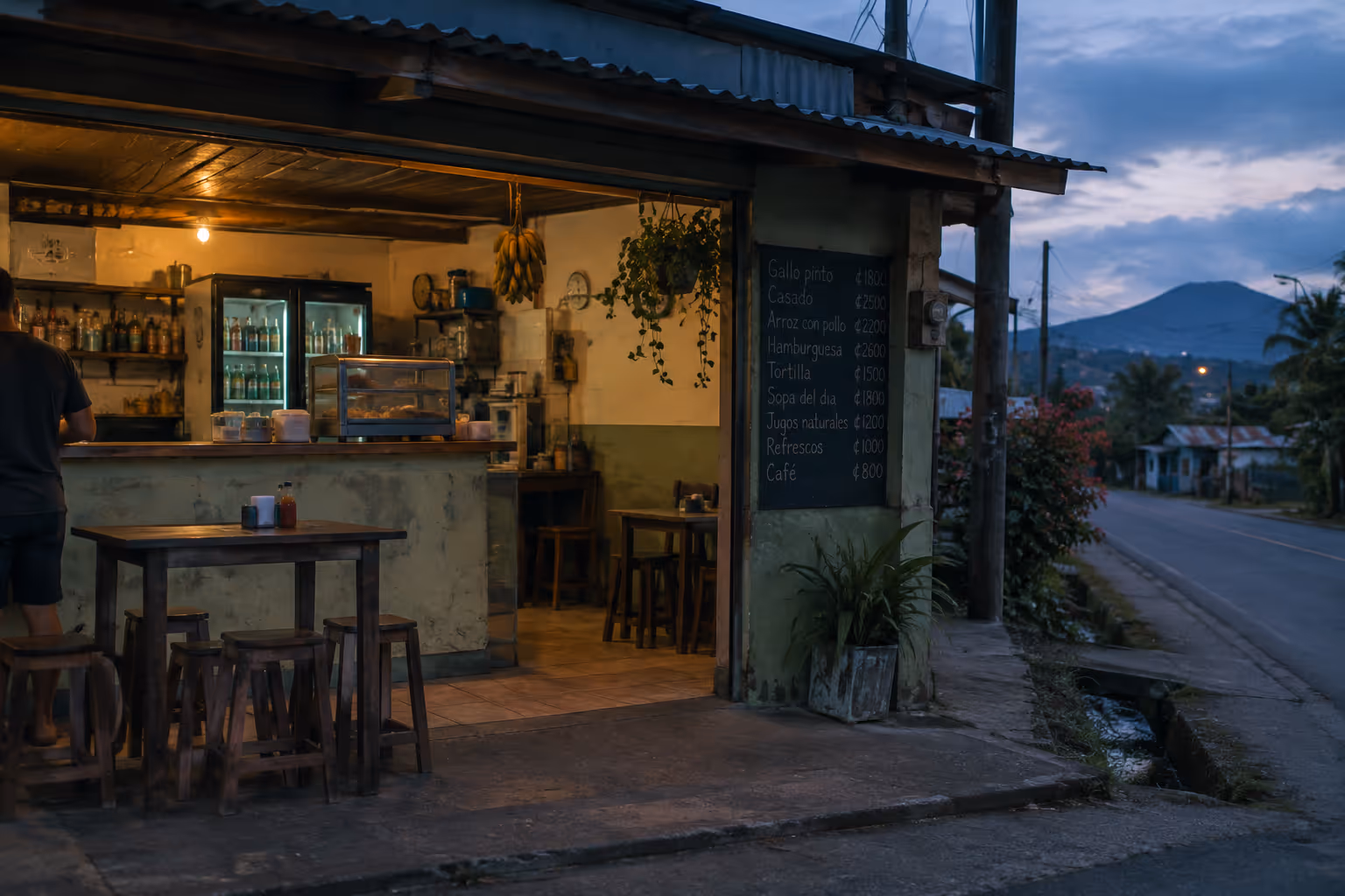 A small roadside café in Costa Rica displays a menu priced in colones.