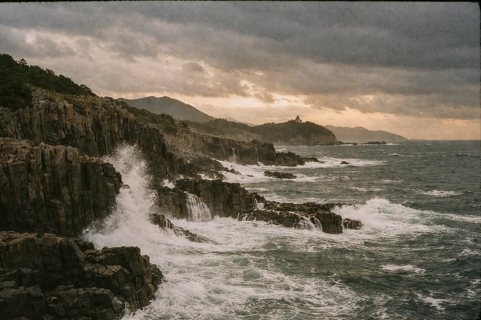 Rugged coastline with dramatic cliffs along a stormy sea under dramatic clouds