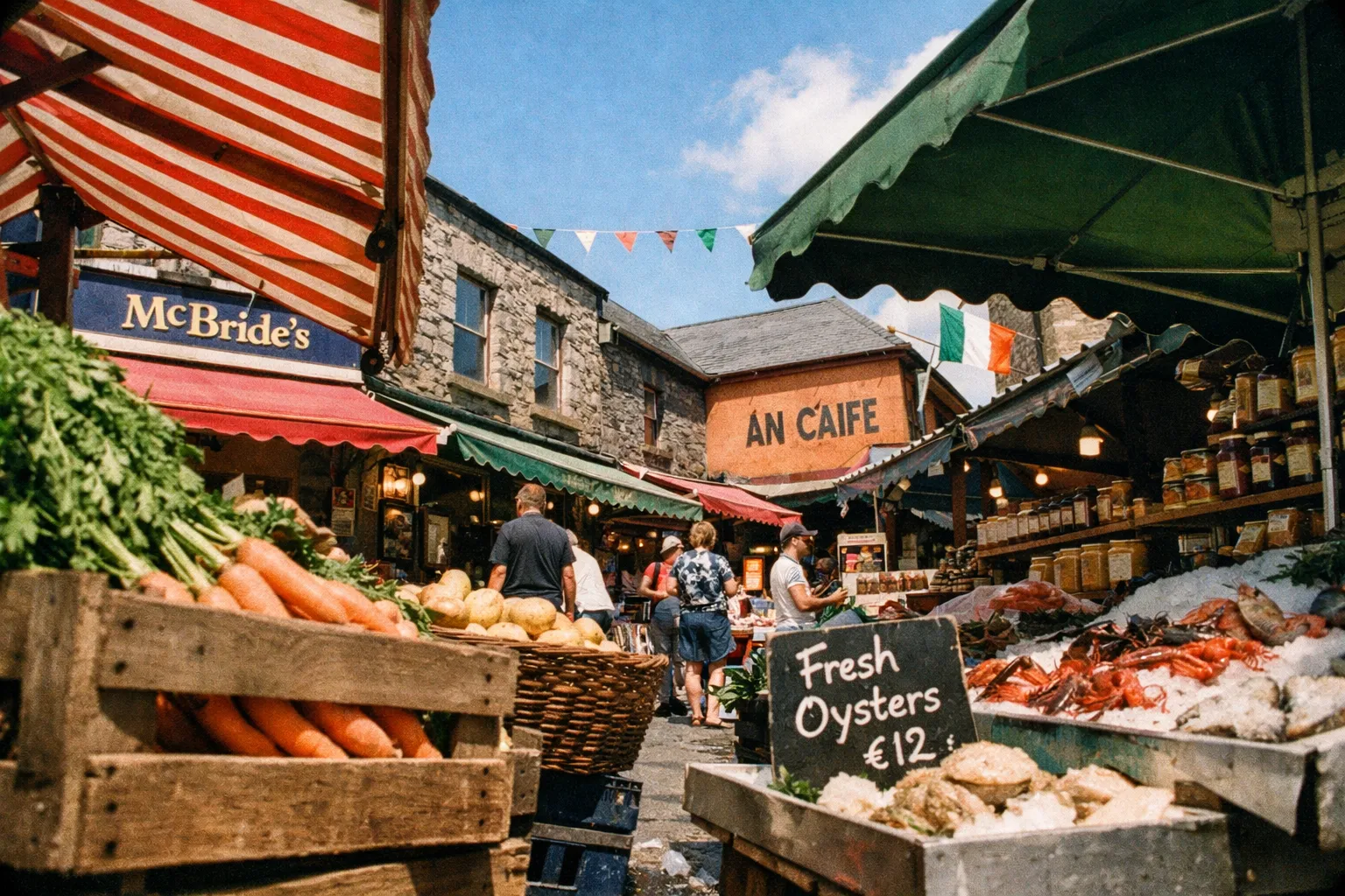 People browsing stalls selling vegetables and seafood at an outdoor Irish market with stone buildings.