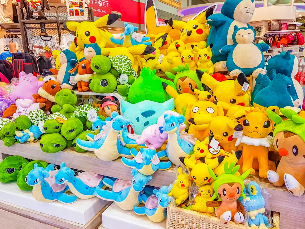 Interior of a Pokémon Center shop in Japan with shelves of plush toys and merchandise