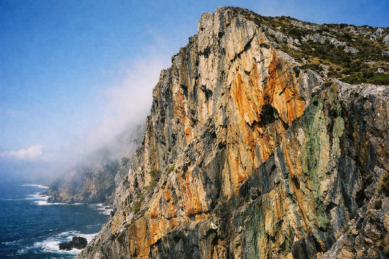 Steep cliffs rise above the Atlantic Ocean at Slieve League in County Donegal, Ireland.