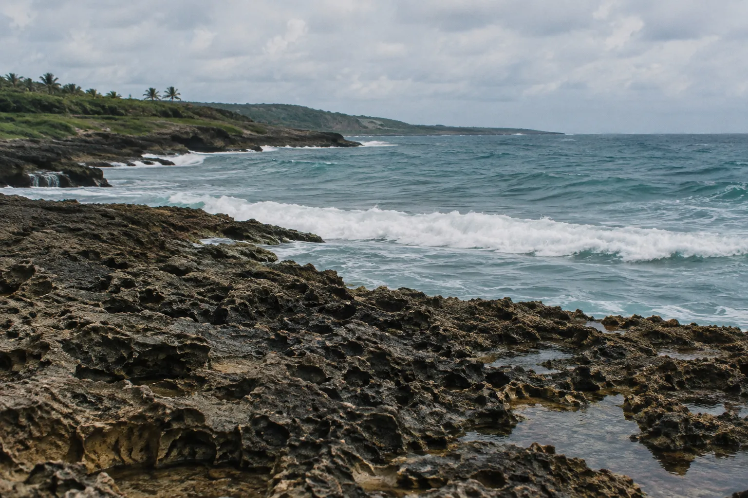 Waves break against a rocky coastline in Aguadilla, Puerto Rico.