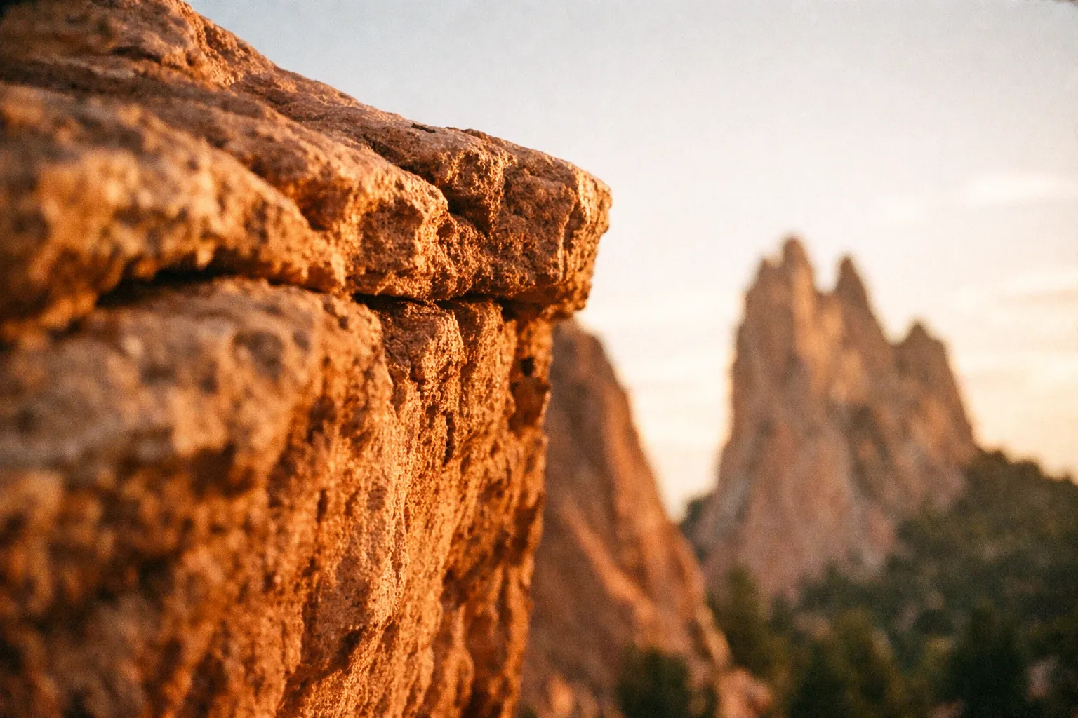 Sunlit red rock formations at Garden of the Gods in Colorado Springs.