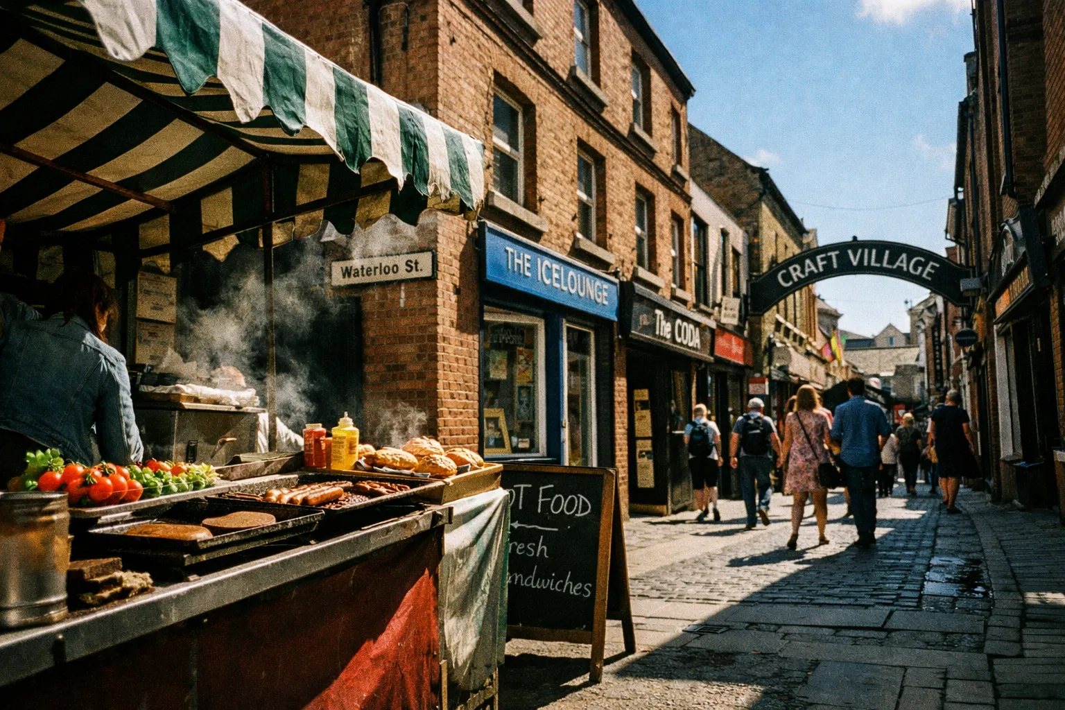 Street food stall and people walking in the Craft Village on Waterloo Street in Derry, Northern Ireland.